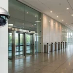 Commercial security cameras and an access control system protecting an office lobby.
