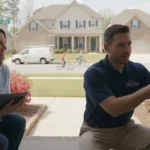 Local home security company professional helping a Greenville homeowner